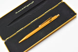 Caran d'Ache 849 Metal Ballpoint Pen - Goldbar With Metal Slim Pack Case